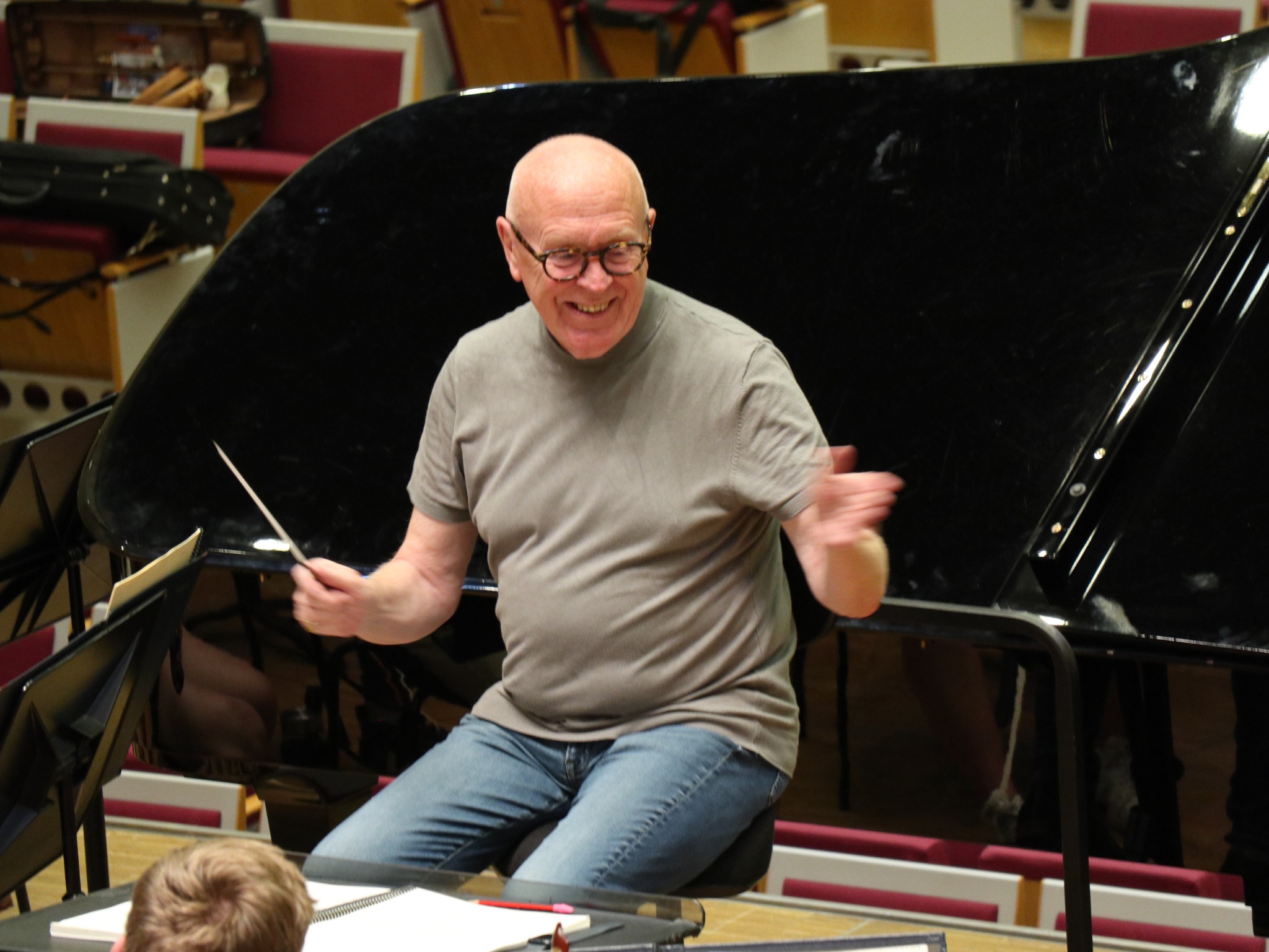 Peter Stark teaching in front of a piano